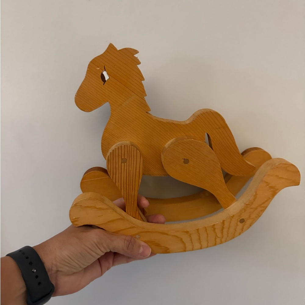 Vintage handcrafted wooden rocking horse. Decor for nursery.
